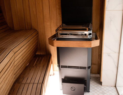 Saunum air L safety rail around installed heater, front room view.