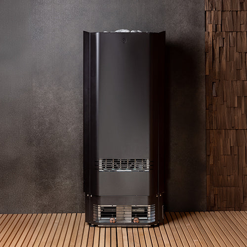Saunum air Perfect heater against textured sauna walls, front view.