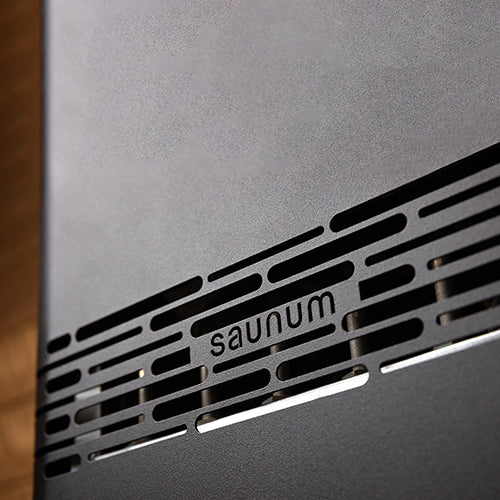 Saunum close-up of Air Perfect perforated ventilation strip and Saunum logo.