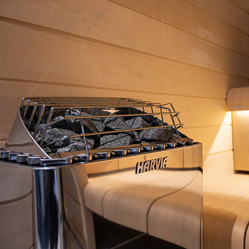 Harvia KIP W-series close-up of the stainless-steel housing, stone basket, and wire guard.