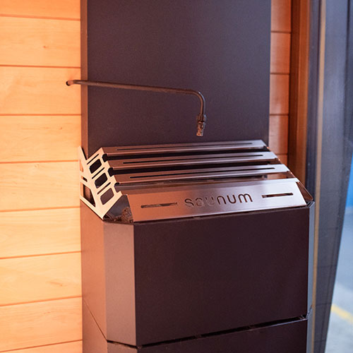 Saunum auto Leil outlet above Air heater, wider front view.