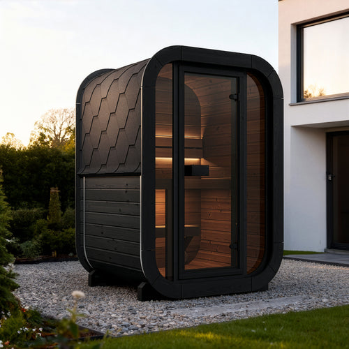 SaunaLife CL3GB black compact cube sauna on gravel beside a modern house.