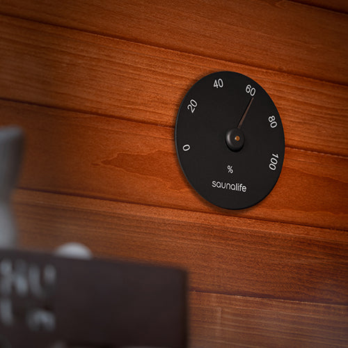 SaunaLife Designer Hygrometer - black humidity gauge mounted on a wood wall