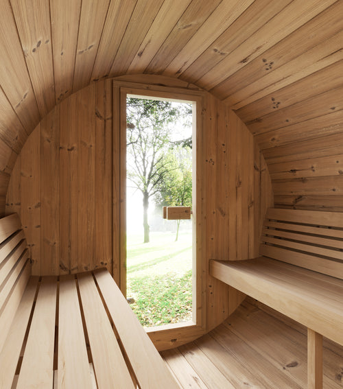 SaunaLife E7B barrel sauna interior showing facing benches and glass entrance door.