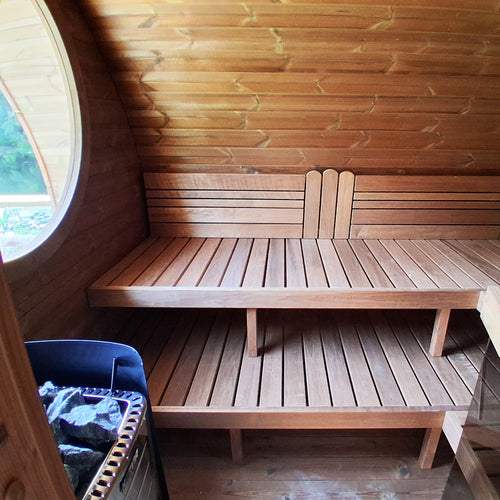 SaunaLife G11B sauna room interior showing stepped benches and heater.