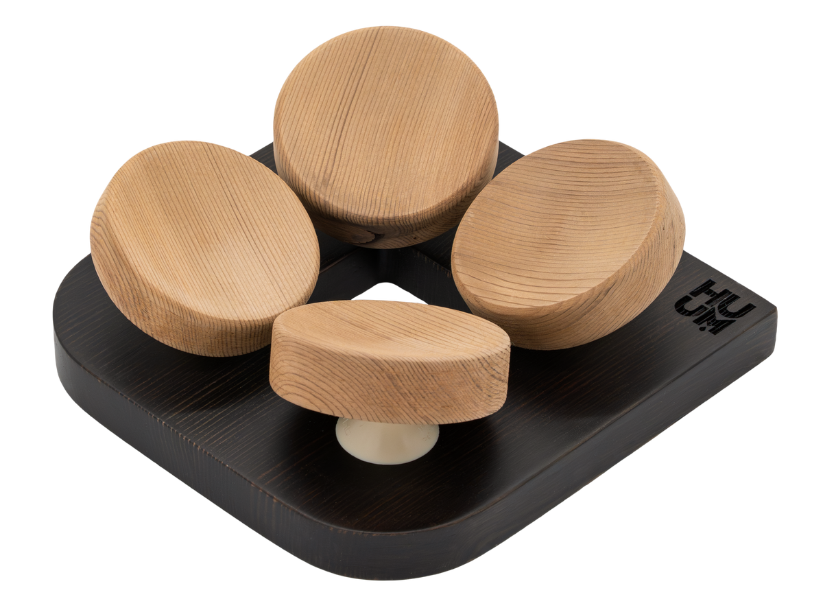 HUUM tASA black headrest with four rounded natural-wood support pads.