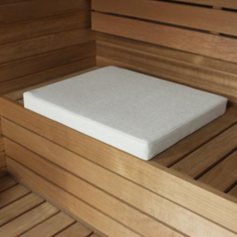 PROSAUNAS SaunaComfort 24 x 20 beige sauna cushion placed on a wooden bench
