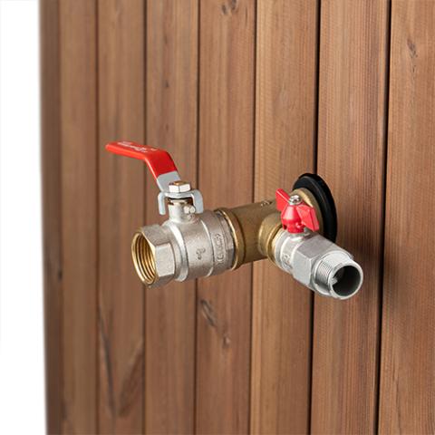 SaunaLife S1N immersion tub water connections and red-handled valves against natural-wood cladding.