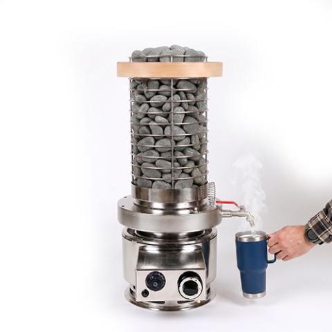 hot water dispensing from the tap into a cup